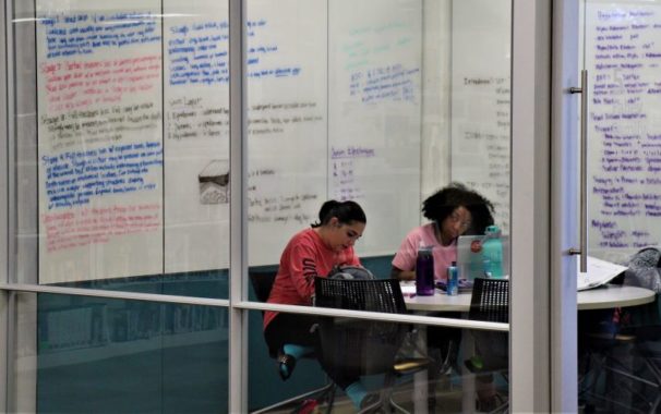 Two students using a library study room